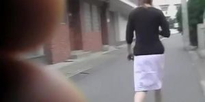 Sharking of graceful Japanese girl wearing a white skirt