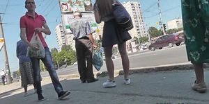 G-string wearing brunette filmed in upskirt video clip
