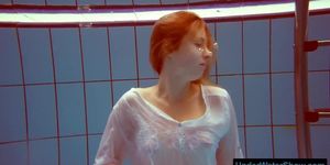 Redhead in a white dress and sexy bikini