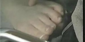 Footjob under table (Isis Taylor)