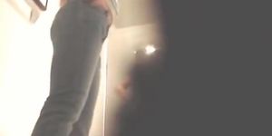 Fun with a naked girl in a shop changing room