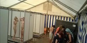 Lots of naked girls in a big public shower