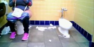 Chubby woman spied in public toilet peeing