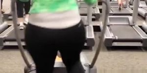 Woman in tight sports pants exercising