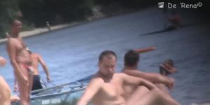 Beach nudist girls show the bodies stretched to crowd