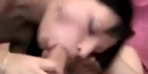 Brunette whore sucks client's cock and uses strap-on on his ass