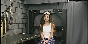 Cute young brunette with tattoo is restrained by Master Len in dungeon