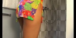 Beautiful girl soaps up in the shower
