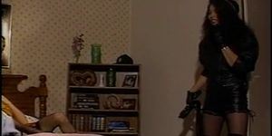 Leather clad squirter watches black and white fuck