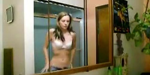 Attractive lady takes off her clothes in this voyeur solo video