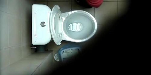 A hidden spy cam catches a chick pissing