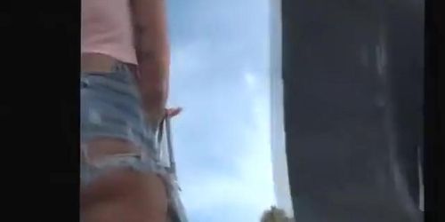 Tattooed girl in torn jeans shorts (Sarah Lollypop)