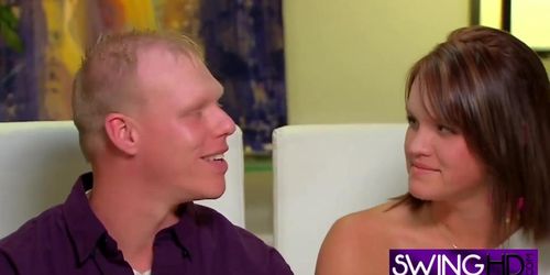 Blonde swinger is being plaased by a guy who is licking her pussy in the Red Orgy Room.