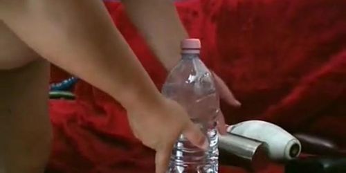 PLUGGED HOLES - Curvy woman fucking a big bottle