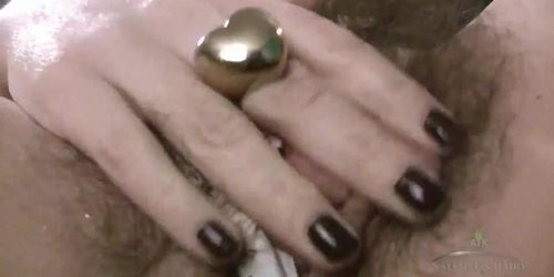 Horny hairy girl Simone Delilah sucks her toy and strips to fuck her sexy hairy pussy to orgasm