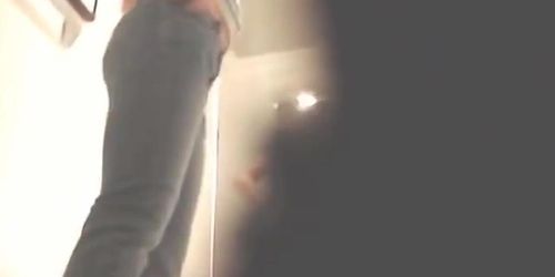 Fun with a naked girl in a shop changing room