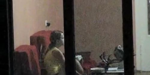 Real window voyeurism of the hot teen alone and topless