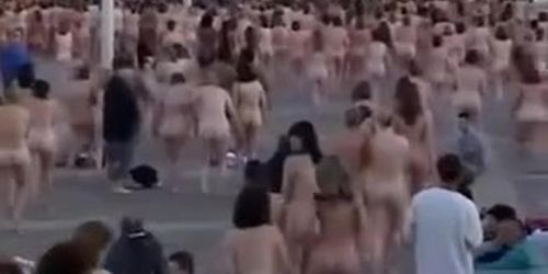 Hundreds of people strip nude to pose for a picture