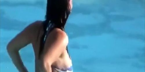 Busty girl's tit pops out while she was going down the waterslide