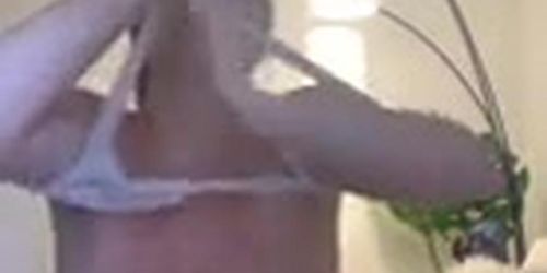 Huge natural boobs trying on a bikini top