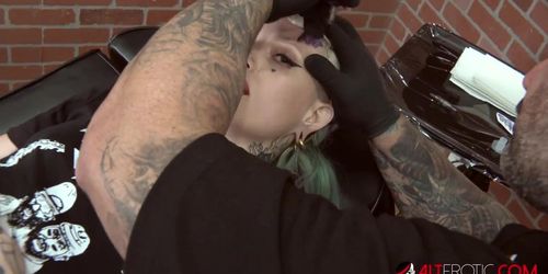 Skinny blonde gets a face tattoo then has her mouth and pussy stuffed by a big cock (Sascha Ink)