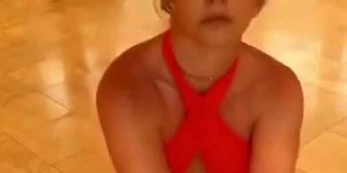 Britney Spears in red top and black bottoms
