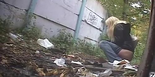 Blonde woman pees twice