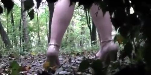 Voyeur is spying and recording two girl pissing in the wood