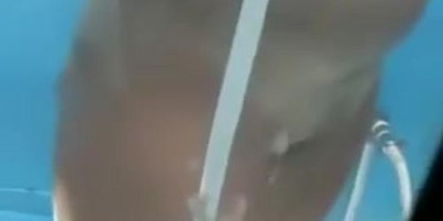 Blonde chick is pouring her tan lined boobs with shower water