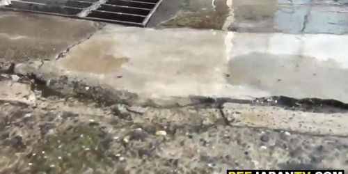 Cute asian takes a pee while clothed