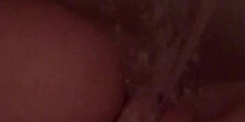 Latina teen with fat shaved pussy masturbates and orgasm with water jet (Fatpussy)