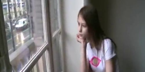 Petite teenager masturbating at window (Lara Page)