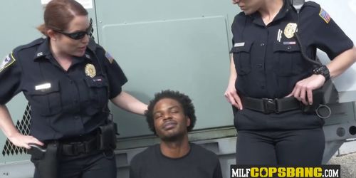 Hardcore interracial sex between two slutty MILFs and a black criminal on the rooftop - video 1