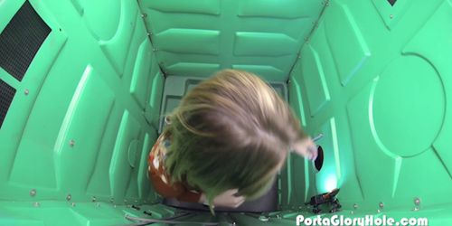 Pale girl sucking cock in parking lot inside of the porta gloryhole at night time
