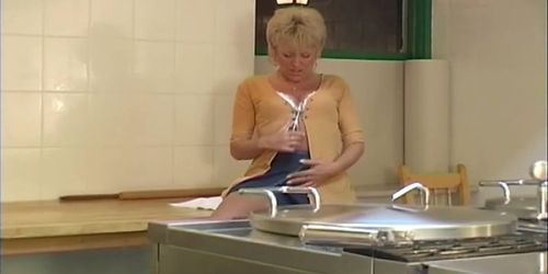 Mature woman in the kitchen