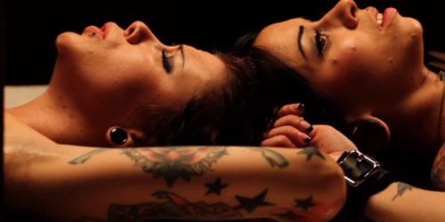 Femdom mistress teases her two restrained subs 