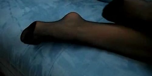 Woman plays in black pantyhose