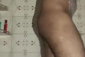 Indian guy playing with a pen in his ass in shower