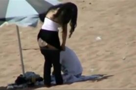 Couple making out on the beach