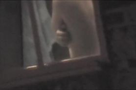 Raunchy window voyeur pics of the hot round titties
