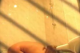 Naughty brunette mature chick  plays with her pussy in the shower