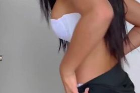 Latina shows her body with a mini skirt