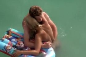 Guy trying to screw her in the water