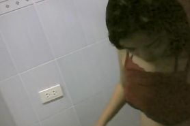 Asian cutie is getting undressed in the bathroom