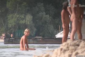 Hot blokes and sexy chicks tanning their bodied on the nudist beach