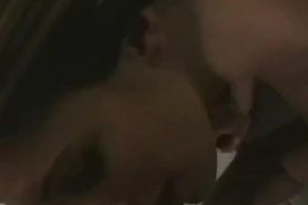 Brunette maintains eye contact while sucking his dick