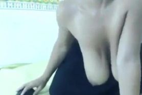 Girl licking and playing with her big tits