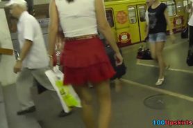 Her red skirt attracts attention of upskirt voyeur guy