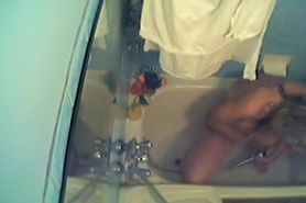 Hidden cam shower girl is masturbating in the bath
