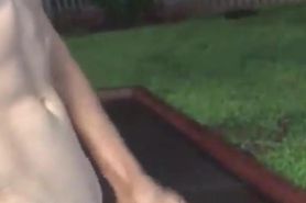 Cumming outside apartment building naked